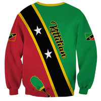 Green crewneck sweatshirt with diagonal flag stripe and Saint Kitts & Nevis text on back