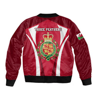Red bomber jacket with black collar trim, back 'THREE FEATHERS' and Wales crest, striped panels