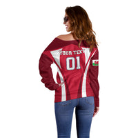 Red off-shoulder rugby sweater back with white stripes and green patch detail