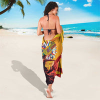 Yellow sarong with multicolor crest and bold maroon stripes, worn by model