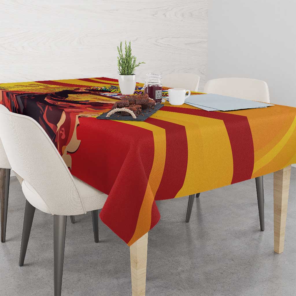 Yellow, red, and dark flamenco-themed tablecloth with bold sweeping stripes