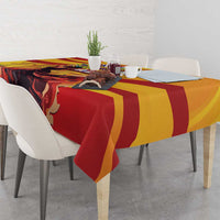 Yellow, red, and dark flamenco-themed tablecloth with bold sweeping stripes