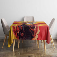 Square tablecloth with yellow and red bold pattern and central illustrated figure