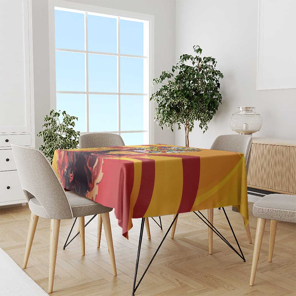 Colorful tablecloth with yellow and red striped design on dining table setting