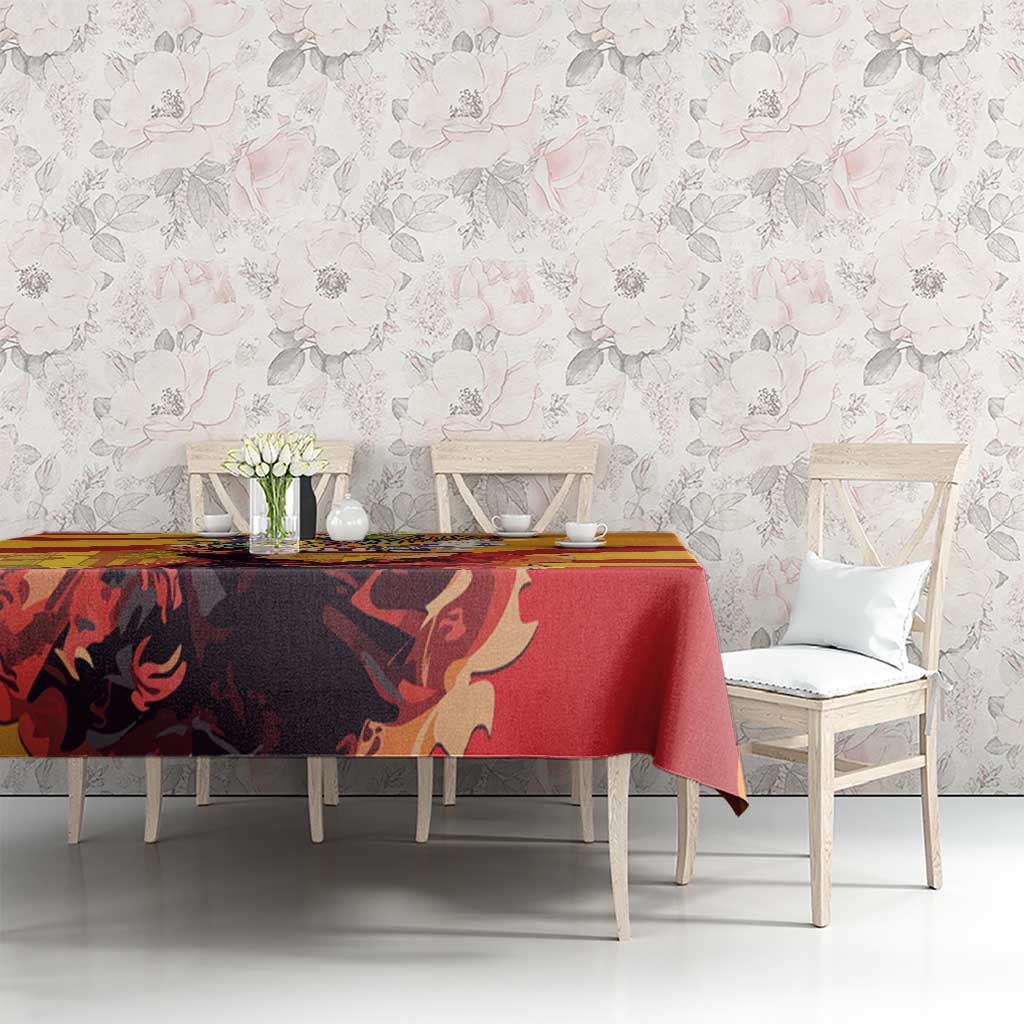 Tablecloth with dark and red central artwork and yellow stripe accents