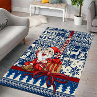 Blue Christmas area rug featuring Santa with ribbon bow across blue geometric motifs