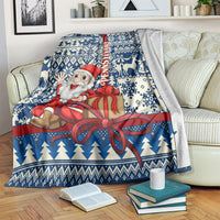Blue Santa Christmas throw with red bow gift ribbon, pine tree and snowflake border pattern