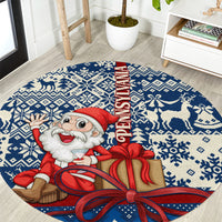 Blue round Christmas rug with Santa holding a gift box and FELIZ NAVIDAD text