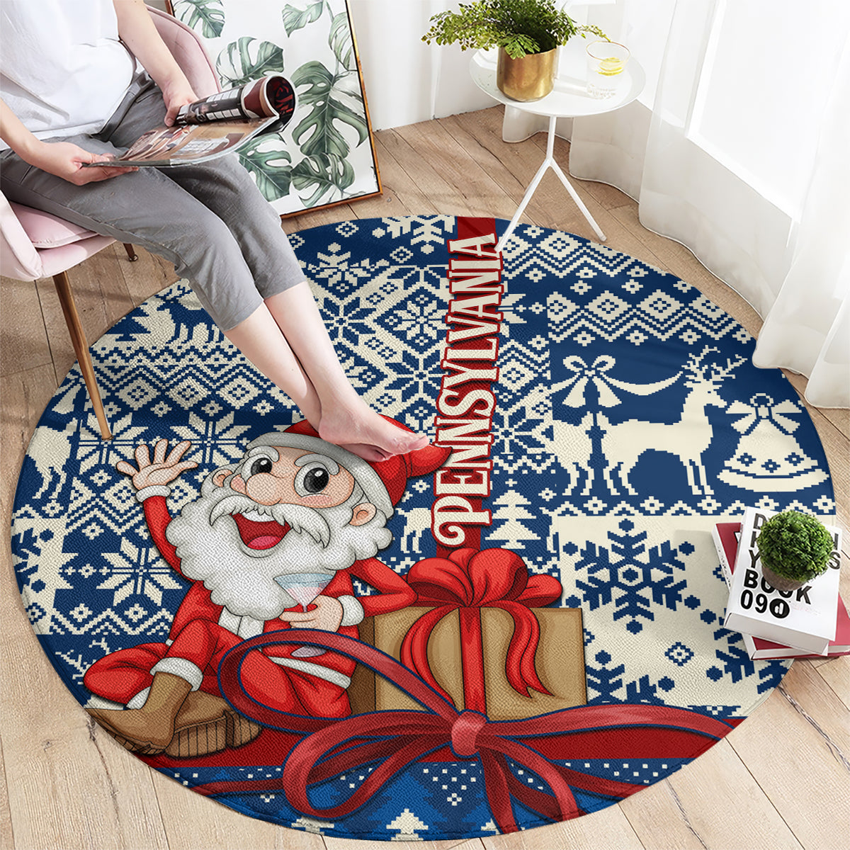 Blue round Christmas rug, top view, Santa holding a gift box and FELIZ NAVIDAD