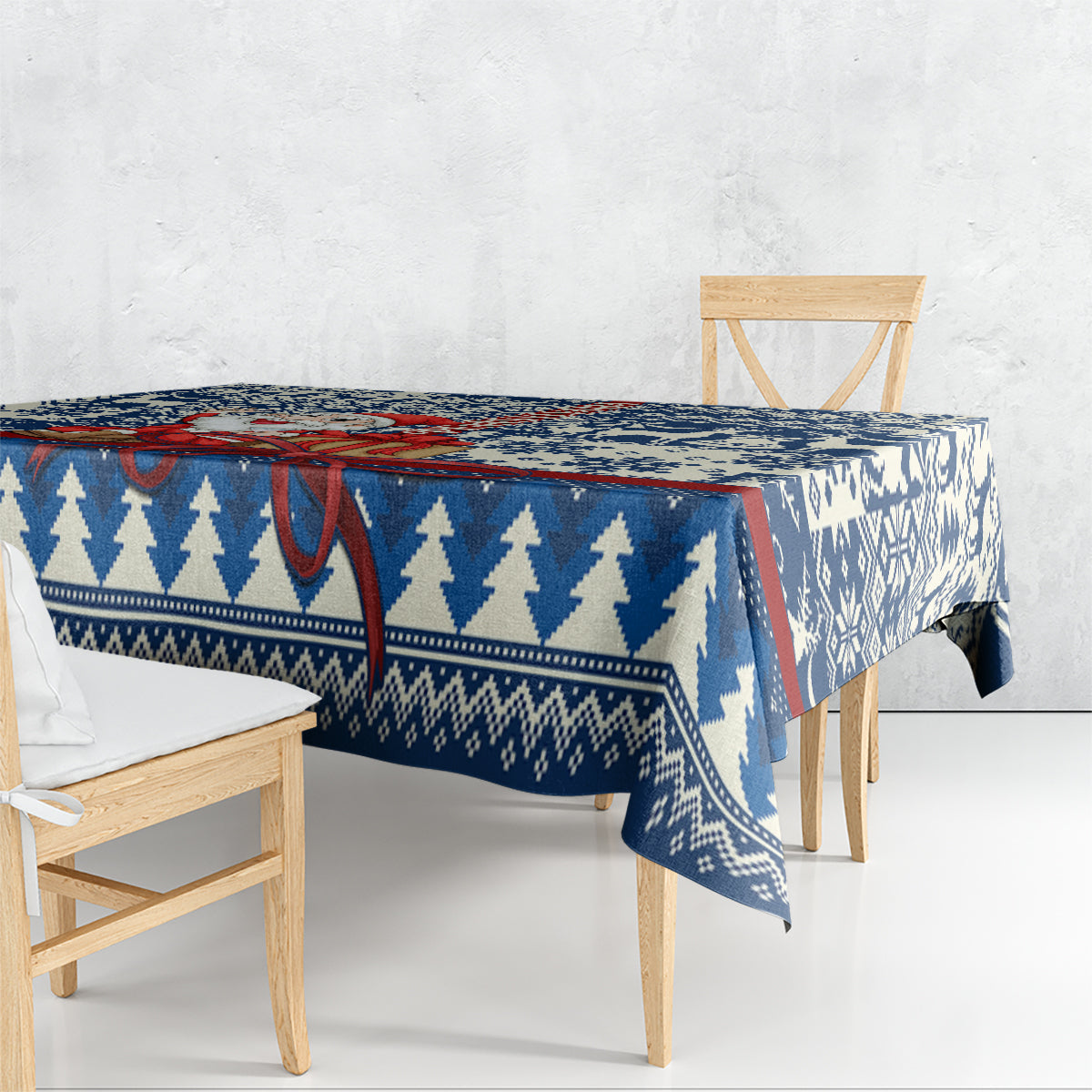 Blue Christmas tablecloth with pine tree and geometric snowflake pattern, draped