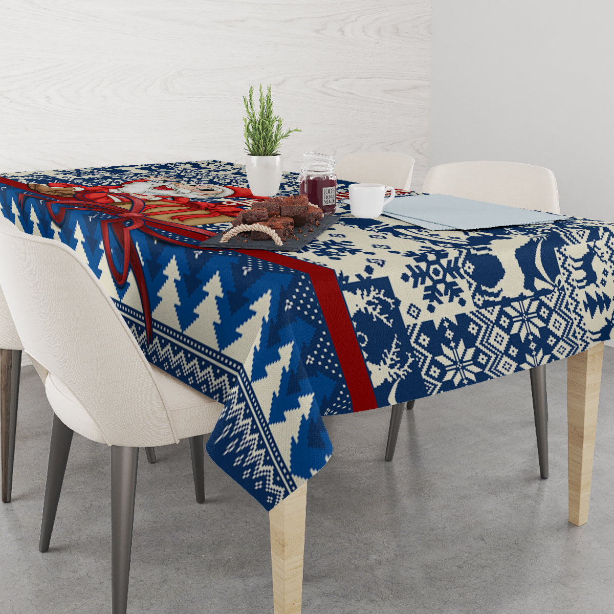 Blue holiday tablecloth with snowflake and reindeer motif, red border stripe