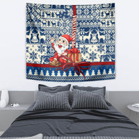 Blue Christmas tapestry featuring Santa in red holding a gift, surrounded by reindeer and pine motifs