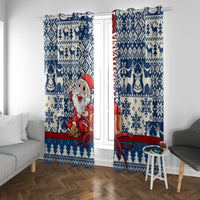 Blue Christmas curtain panel pair featuring Santa with red scarf and bow accent