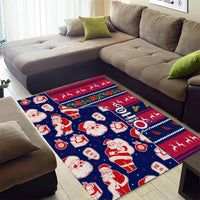 Blue Christmas area rug with Santa figures, presents, reindeer, and zigzag holiday trim