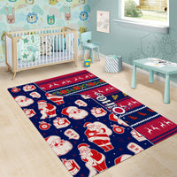 Blue Christmas area rug with Santa and gift icons and colorful holiday stripe border