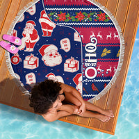 Round blue Christmas beach blanket laid flat with Santa, gifts, and Ohio-themed graphic