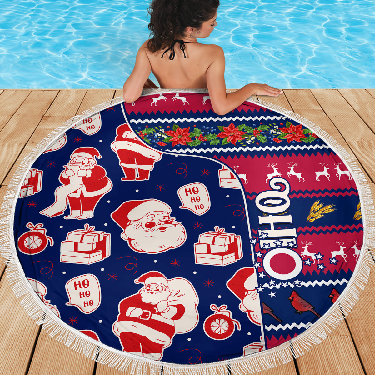 Round blue Christmas beach blanket with Santa and gifts, visible fringe edge