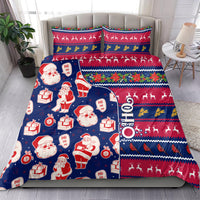 Blue Christmas bedding set with Santa figures, presents, and striped reindeer border