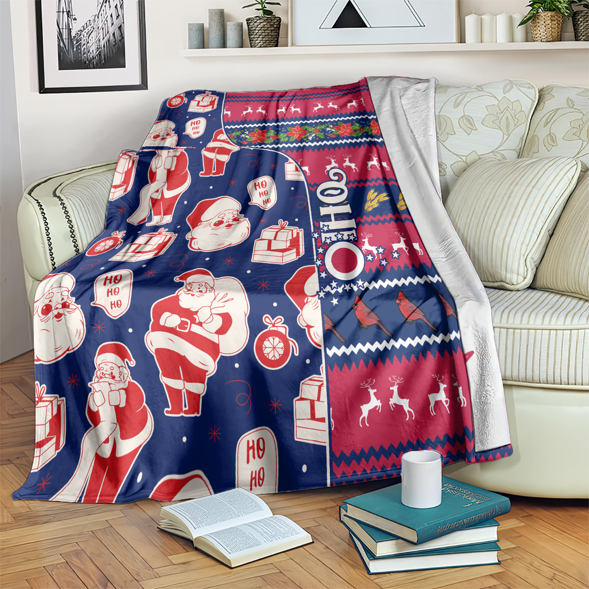 Santa and gift print Christmas blanket draped over couch with red, blue, and festive border