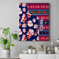 Blue Santa holiday canvas wall art with red and white pattern, framed