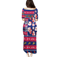 Blue long Christmas dress, back view, Santa and reindeer festive pattern, short sleeves