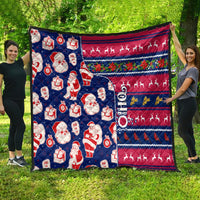 Blue Christmas quilt with Santa figures, gift icons, reindeer silhouettes, full view