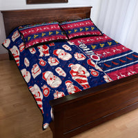 Blue and red Christmas quilt bed set with Santa, gift boxes, and reindeer on quilt and shams
