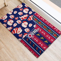 Blue Christmas doormat angled display with Santa faces, gifts, and striped border