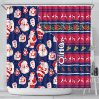 Blue holiday shower curtain with Santa figures, presents, and red festive stripe section.