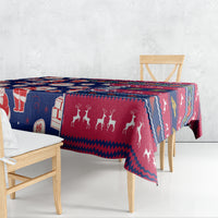 Custom Ohio Christmas tablecloth draped over table edge with Santa and deer design.