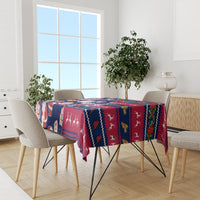 Custom Ohio Christmas tablecloth on dining table with Santa, reindeer, and gift icons.