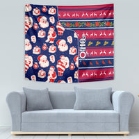 Blue Christmas tapestry with Santa, toy gifts, and red patterned bands of reindeer silhouettes.