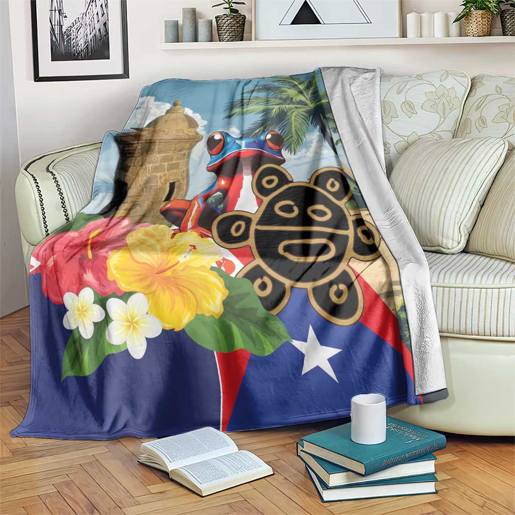 Blue Puerto Rico-themed blanket with El Morro tower, coqui frog, palm leaves and flowers