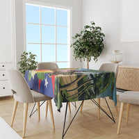 Colorful tablecloth draped over a dining table, featuring Puerto Rican flag colors and palms