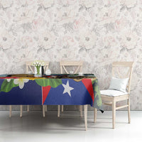 Colorful tablecloth on table with Puerto Rican flag colors and leafy pattern
