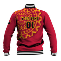 Red back varsity jacket with circular emblem, bold text, and striped hem and sleeves