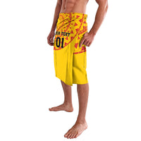 Men's yellow football lava lava skirt with red patterned waist panel, side view