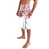 White lavalava with red patterned waistband and split front hem