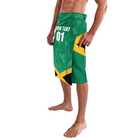 Green Jamaica graphic shorts showing 'YOUR TEXT 01' and yellow flag-style artwork
