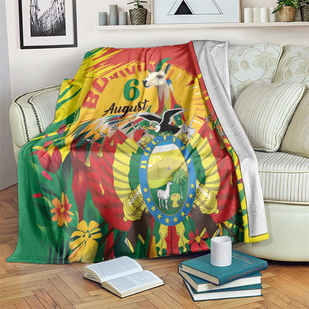 Festival throw blanket in red, yellow, and green with “Bolivia” and “August” central design
