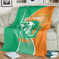Cote d'Ivoire independence day blanket on armchair, elephant and 1960 print, green and orange