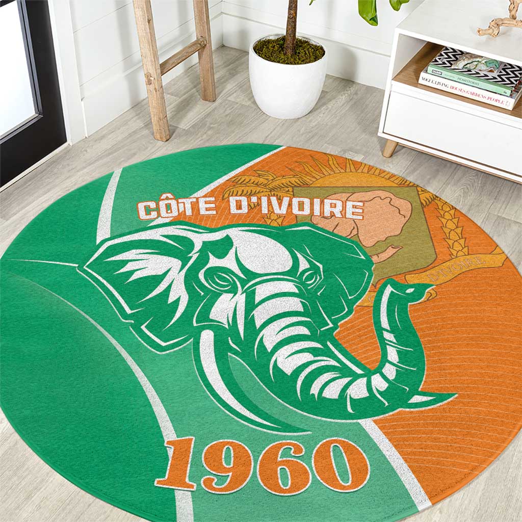 Round Côte d'Ivoire elephant rug in green and orange with 1960 graphic