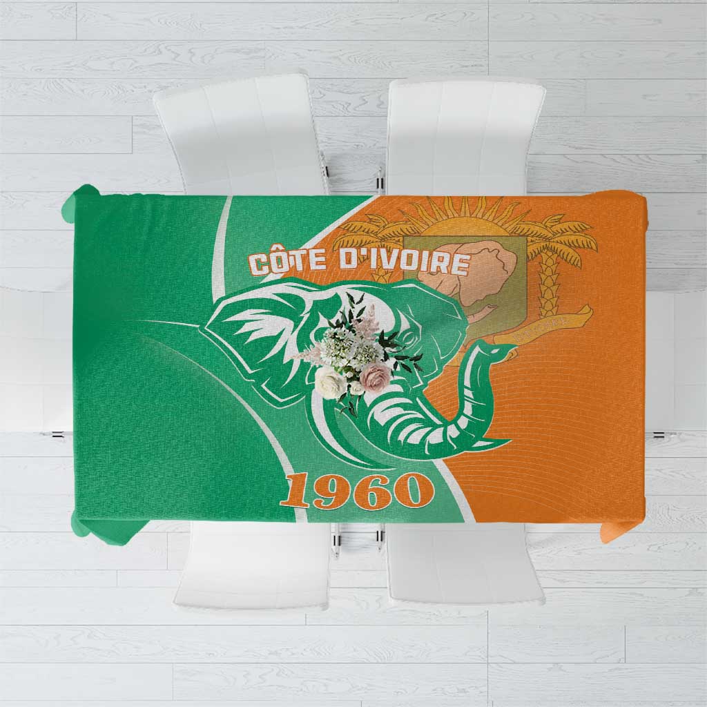 Two-tone green and orange elephant-themed tablecloth with bold emblem design
