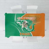 Two-tone green and orange elephant-themed tablecloth with bold emblem design