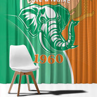 Window curtain close-up: green and orange elephant graphic with '1960' year print