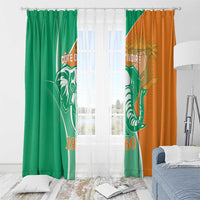 Window curtains in green and orange with elephant emblem and '1960' year print