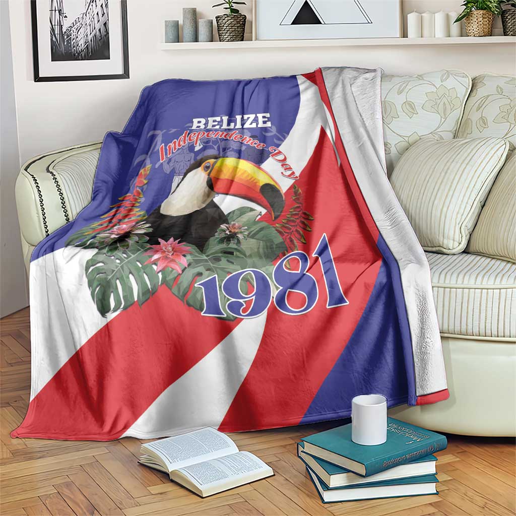 Belize Independence Day 1981 blanket draped on bed, blue/red/white flag with toucan