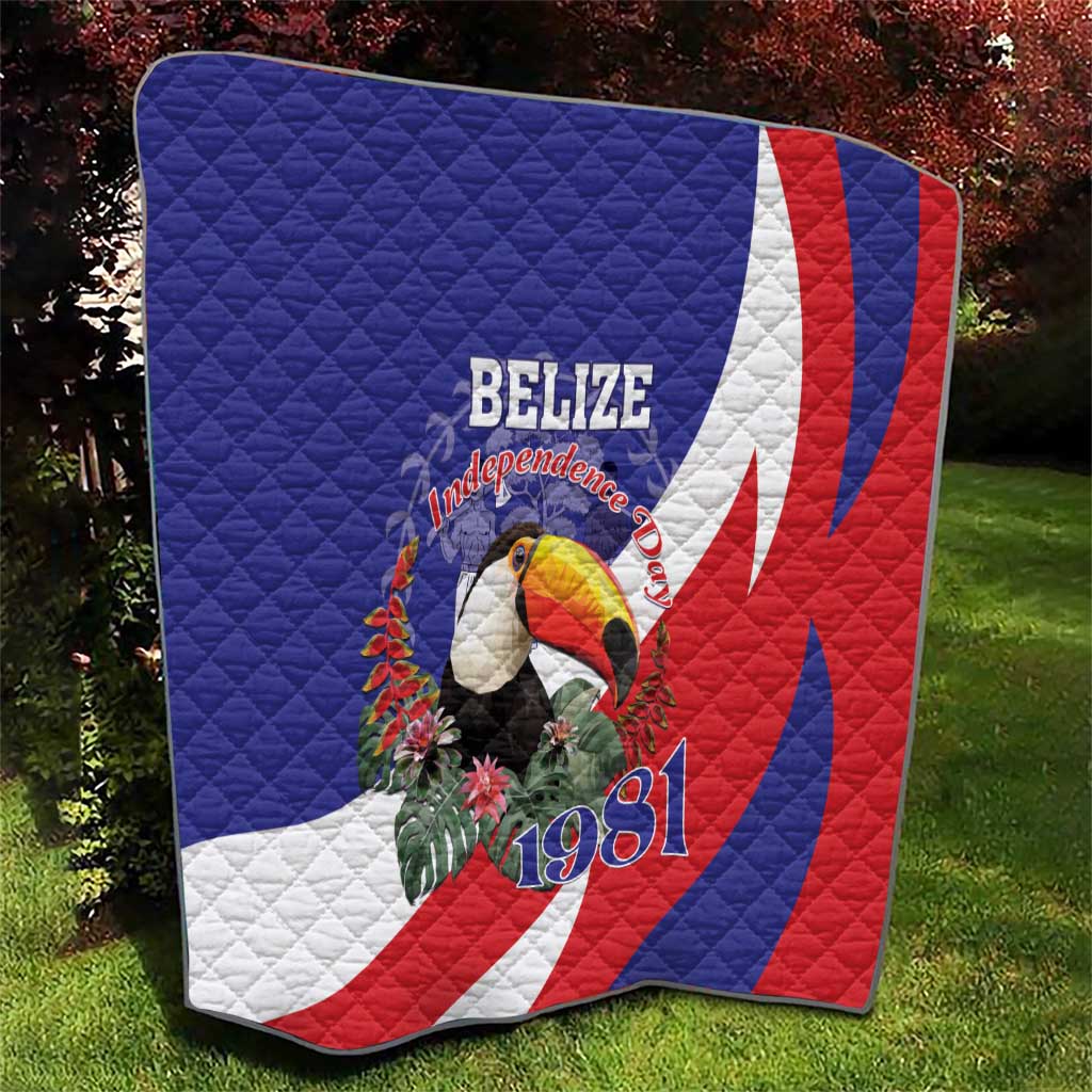 Blue, red, and white Belize Independence 1981 quilt with toucan centerpiece and stripes.