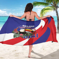 Printed sarong with bold blue, red, and white Belize flag pattern and toucan