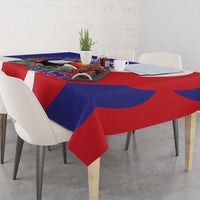 Colorful blue and red tablecloth with printed graphic and white accents
